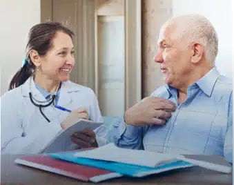 Physician reviewing test results with an older patient