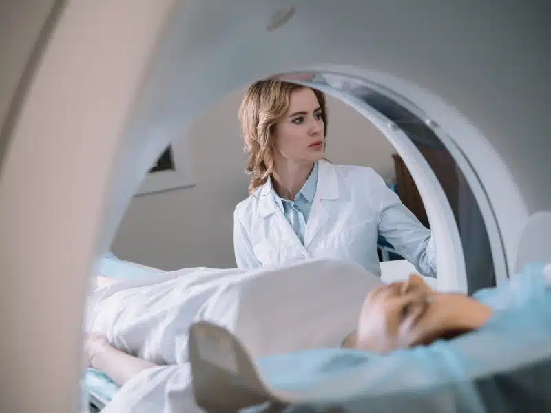 Technologist positioning a patient for a CT scan
