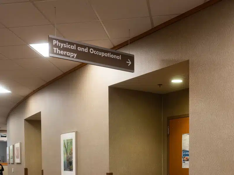 Hallway sign pointing to Physical and Occupational Therapy at Girard Medical Center