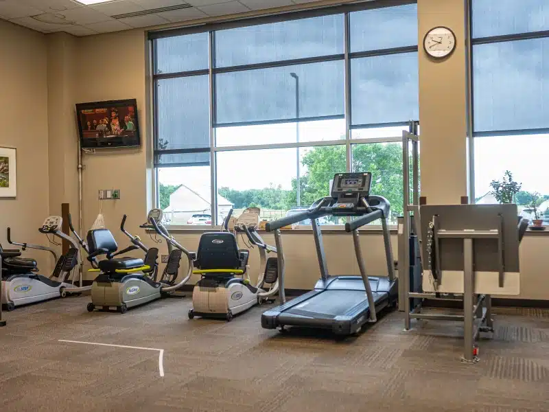 Girard Medical Center rehabilitation gym with a treadmill, exercise bikes and weight equipment