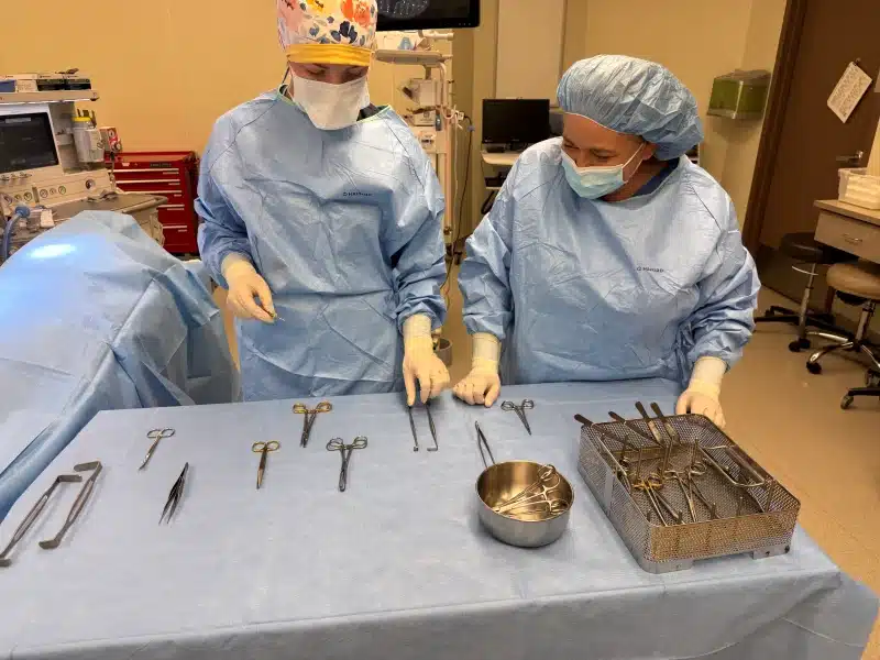 Surgical team preparing instruments in a Girard Medical Center operating room