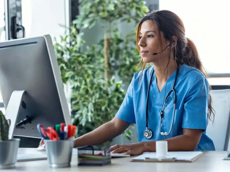 Health Information Management staff member assisting a patient by phone